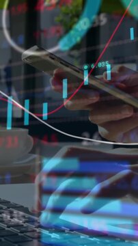 Financial data processing against mid section of person using laptop and smartphone