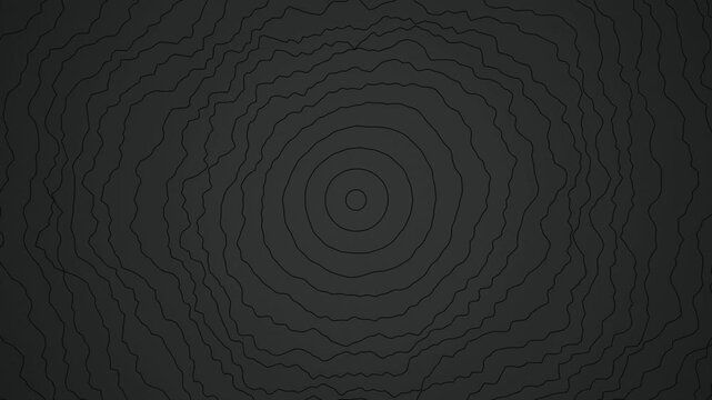 Concentric charcoal tree ring lines ripple in a seamless loop