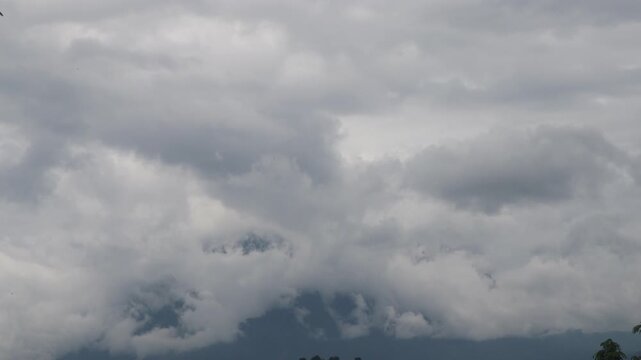 Beautiful cloud formations preceding the rain, covering Doi Luang Chiang Dao mountain in Chiang Dao district, Chiang Mai province