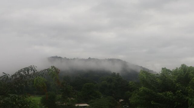 Beautiful cloud formations preceding the rain, covering Doi Luang Chiang Dao mountain in Chiang Dao district, Chiang Mai province