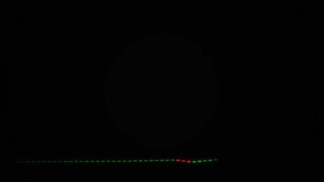 A sequence of glowing green light points moves horizontally across the pitch black expanse while a single red marker indicates a specific temporal threshold within the continuous digital data