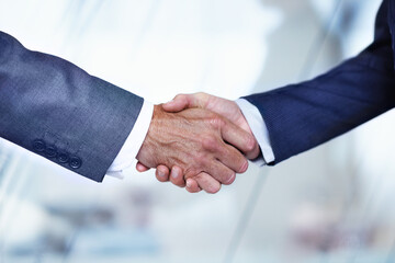 Office, shaking hands and business men for meeting, financial partnership and b2b merger in lobby. Corporate, onboarding and people with handshake for success, investment deal and finance agreement © peopleimages.com