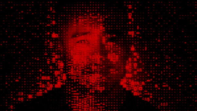 Male Face dissolving into Computer Data, symbolising Cyber Security Concept.