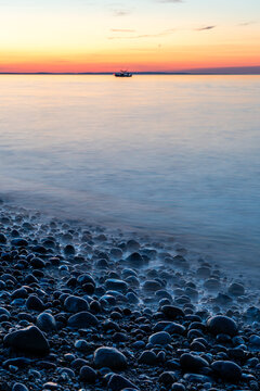Rocky shoreline with calm water at sunset