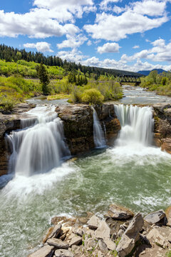 Crowsnest river water cascading over Lundbreck falls on a sunny day