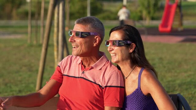 Middle aged partners enjoying unforgettable solar eclipse