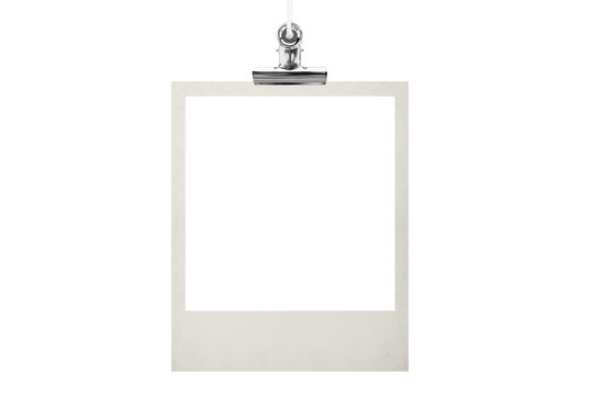 Blank photo frame hanging on a rope with a metal clip clothespin. Isolated transparent PNG mockup.