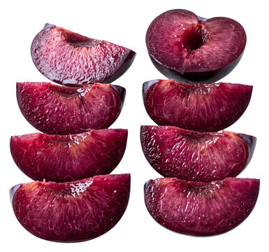 Fresh Ripe Plum Halves Stacked Artfully Isolated.