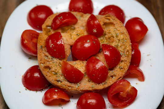 Fresella with cherry tomatoes, oregano, and extra virgin olive.