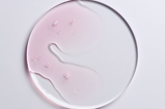 Pink cosmetic product for skin care. A serum or body gel or a moisturizer.