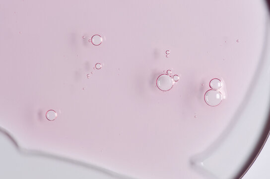 Pink cosmetic product for skin care. A serum or body gel or a moisturizer.