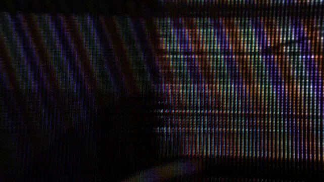 CRT screen with fine colorful horizontal streaks and analog signal glitch, macro close-up texture.
