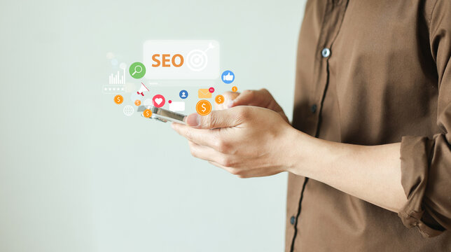 close up man hand tuse smartphone to search engine optimization (SEO) tools for finding customer or promote and advertise about content online for marketing technology and business concept
