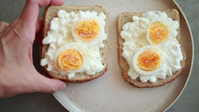 Healthy Toast with Cottage Cheese, Sliced Boiled Egg, and Sesame Seeds Close Up
