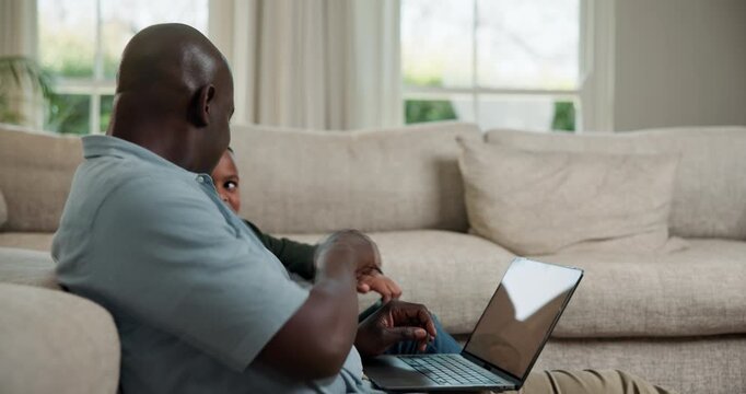 Laptop, remote work and dad with child in lounge, copywriting and explaining project to son in home. Creative, freelancer and black man with tech for article, family and discussion with kid in house