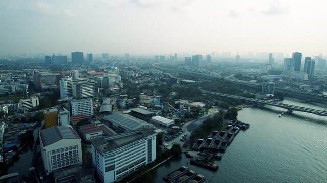 Industrial Barges Moored Below Elevated Highway Rail
