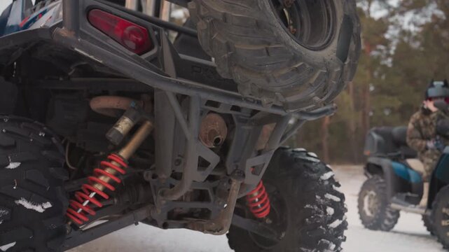Adventurous snow vehicle stunts. Vibrant background highlights thrilling offroad snow ATV performances. Dynamic snow adventure featuring bold ATV tricks against colorful and energetic backdrop