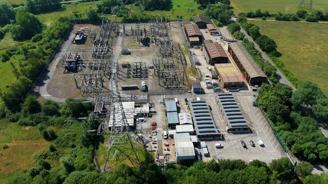 Aerial view of the National Grid Thorpe Marsh Substation featuring electrical infrastructure, transformers, and surrounding greenery in Barnby Dun, England, United Kingdom.