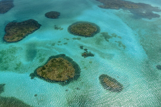 Aerial view of the natural pools at Piscinas naturais em Ponta do Seixas with vibrant turquoise water and coral formations in Joao Pessoa, State of Paraiba, Brazil.