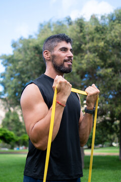 Man doing bicep curl with resistance band