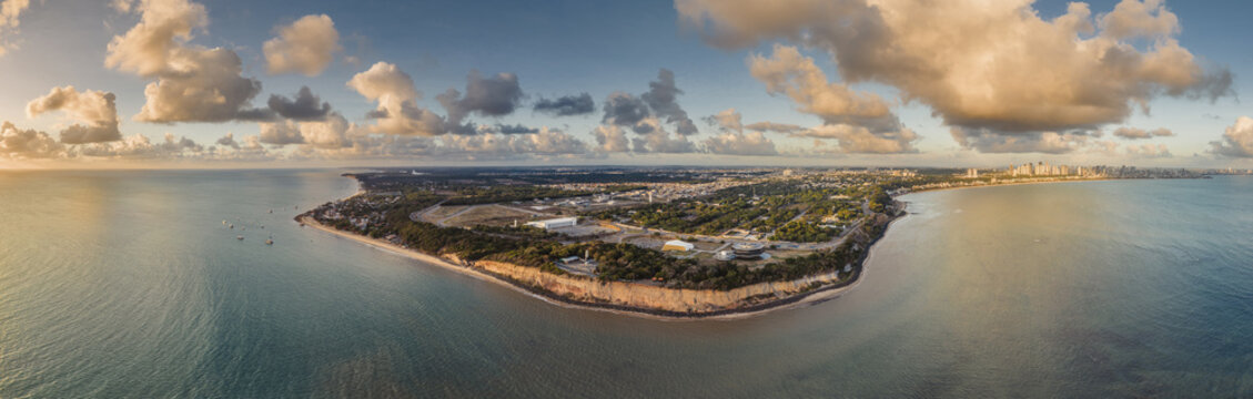 Aerial view of Ponta do Seixas, the easternmost point of the Americas, featuring dramatic cliffs, lush vegetation, and the Atlantic Ocean coastline in Joao Pessoa, Paraiba, Brazil.