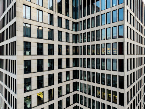 Aerial view of the modern office building facade with a grid of windows and stone cladding in Krakow, Lesser Poland Voivode, Poland.