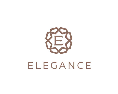 Luxury letter E ornament logo design. Elegant gold geometric initial logotype. Premium emblem for hotel, beauty, fashion and wealth management brands.