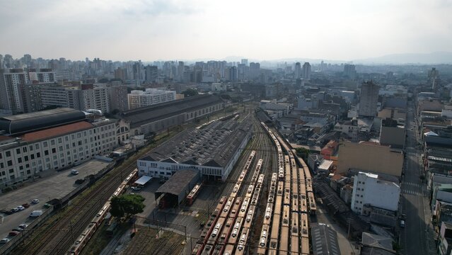 Aerial view of the historic Luz Station with its extensive railway tracks and trains surrounded by the dense urban cityscape of Sao Paulo, State of Sao Paulo, Brazil.