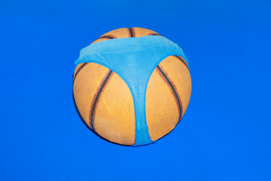 A basketball wears blue underwear against a blue background