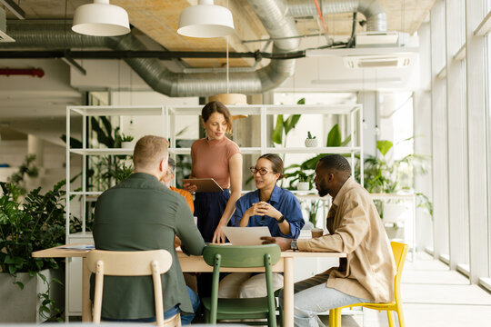 Business colleagues discuss new ideas in a modern office