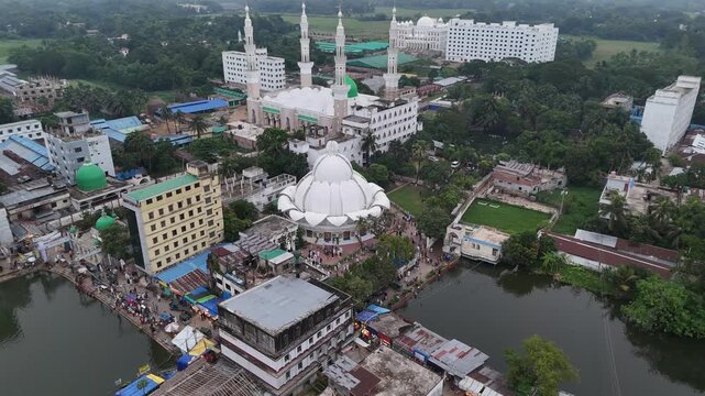 Aerial view of the Maizbhandar Darbar Sharif complex with its white dome, mosque buildings, and water bodies in Fatikchhari Upazila, Chittagong Division, Bangladesh.