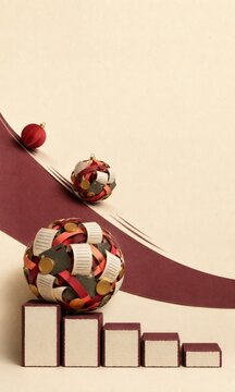 Post-Holiday Debt Snowball Effect Concept with Paper-Craft Christmas Ornaments, Receipts, Credit Card Fragments and Budget Blocks on Minimal Background. AI generative