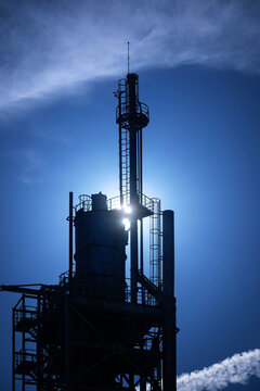 View of the industrial tower silhouette at Parque das Nacoes against a bright blue sky in Lisbon, Lisbon, Portugal.