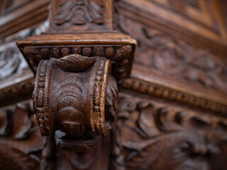 Close up of a carved oak corbel with egg and dart and foliate ornament in a historic church, woodwork craftsmanship and heritage detail. © Victor