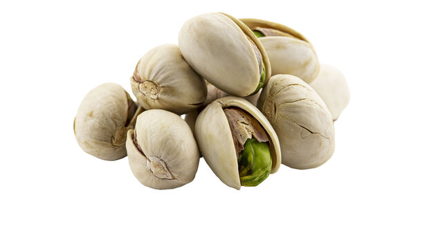 Pile of shelled and unshelled pistachios with green kernels