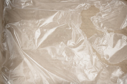 overlay effect. crumpled plastic wrap on brown card paper. transparent background. PNG file.