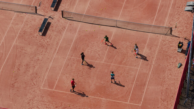 Aerial view of Tennisclub IJburg with people playing tennis on a clay court in Amsterdam, Noord-Holland, Netherlands.
