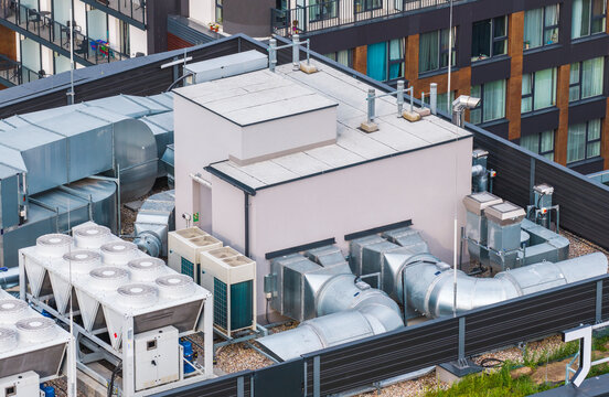 Aerial view of industrial HVAC ventilation systems and cooling units installed on a modern building rooftop in Gdansk, Pomeranian Voivodeship, Poland.