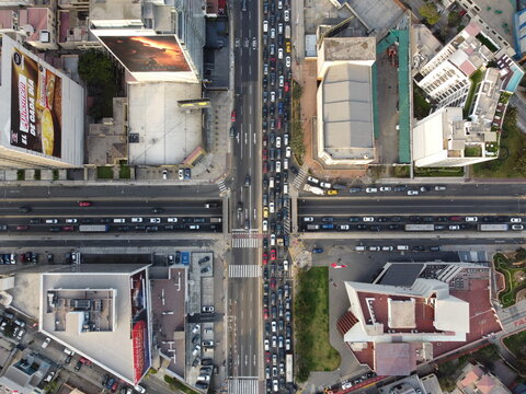 Aerial view of Avenida Arequipa featuring heavy traffic congestion, modern office buildings, and urban infrastructure in San Isidro, Lima Province, Peru.
