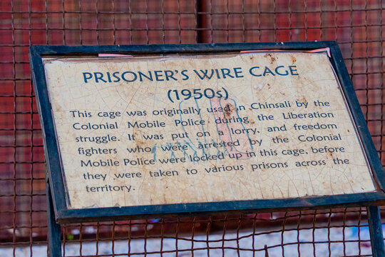 Lusaka, Zambia - 01 July 2026: View of the Prisoner's Wire Cage, a historical artifact used by the Colonial Mobile Police during the liberation struggle, displayed with descriptive signage.