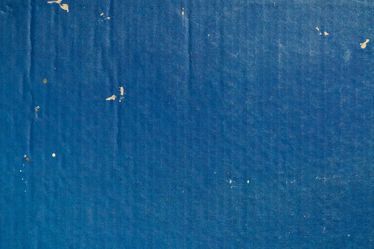 blue corrugated paperboard scratch. natural corrugated cardboard texture abstract background