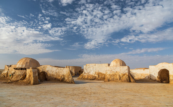 View of the Star Wars Mos Espa film set with iconic dome-shaped structures and desert architecture in Nefta, Tozeur Governorate, Tunisia.