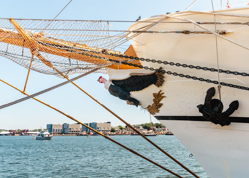 Boston, Massachusetts, United States - 12 July 2026: View of the docked tall ship BAE Guayas of Ecuador's bow, featuring its ornate figurehead, anchor, and rigging.