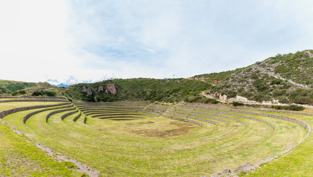 View of the circular agricultural terraces of Moray with stone retaining walls and grassy levels in the Andes mountains, Cusco, Cusco, Peru.