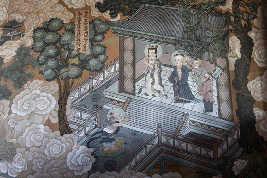 View of a traditional Chinese mural painting inside Huayan Temple featuring figures in historical attire, stylized clouds, and architectural elements in Datong Shi, Shanxi Sheng, China.