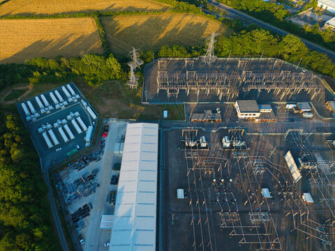 Aerial view of Enderby Substation National Grid and Battery Energy Storage Systems with electrical infrastructure and power lines in the countryside of Leicester, England, United Kingdom.