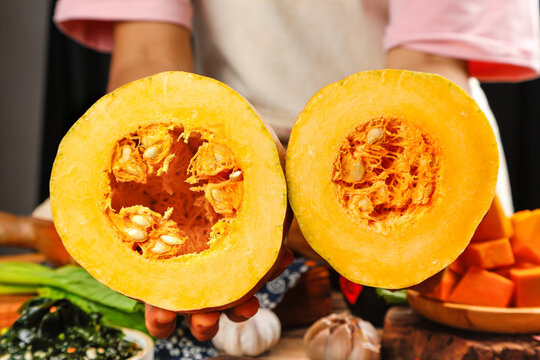 Fresh Yellow Squash Halves with Seeds and Pulp in Kitchen Food Preparation