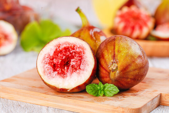 Fresh Yunnan Figs with Red Flesh on Wooden Board - Healthy Tropical Fruit