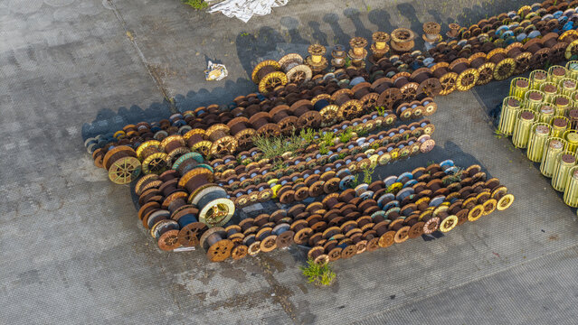 Aerial view of industrial cable reels and spools stored in the yard of Tele-Fonika Kable S.A. in Krakow, Malopolskie, Poland.