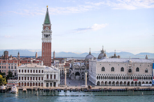 Aerial view of St. Mark's Square with the iconic Campanile, Doge's Palace, and historic architecture along the waterfront in Venice, Veneto, Italy.